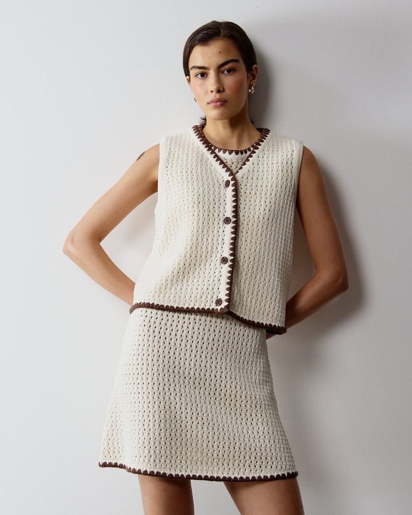 Model wears Aligne's SS25 Camilla Buttoned Crochet Top
