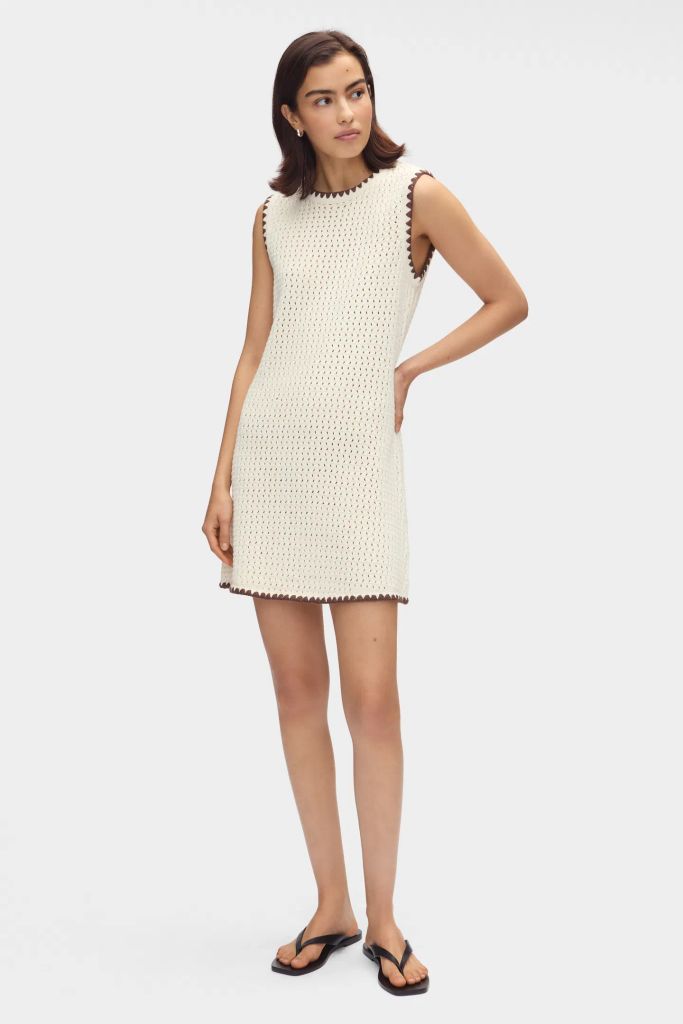 Model wears Aligne SS25 Immy Crochet Mini Dress with leather throngs